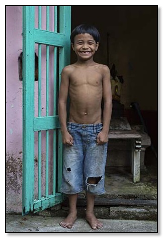 Young boy with big toothy grin
